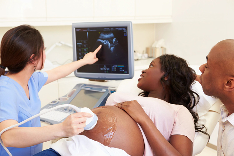 A pregnant woman getting her womb checked